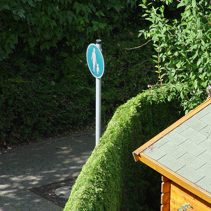two children cross sidewalk