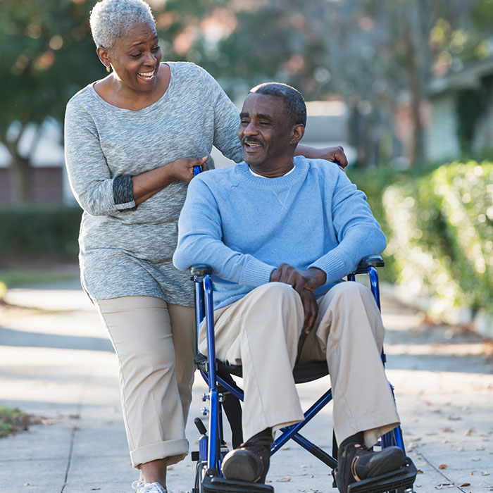 elderly couple with wheelchair