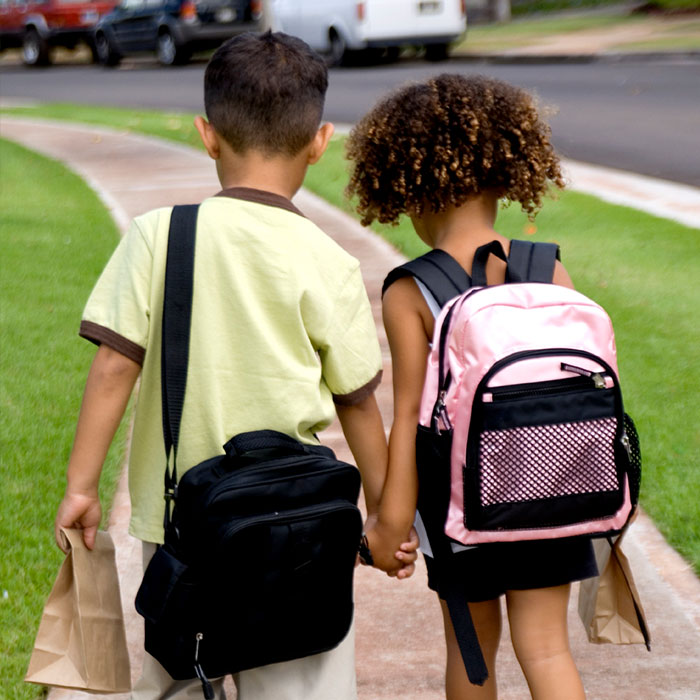 two children on sidewalk